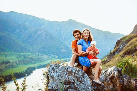 Family holiday with 6 month old baby in the mountains among the rocks, and spaces joyの写真素材