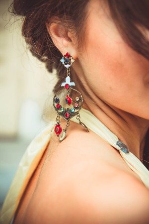 Closeup portrait of a young beautiful model with makeup and jewelryの写真素材
