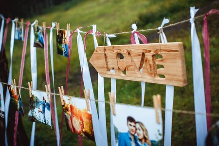 photos of lovers hanging on a rope outdoors