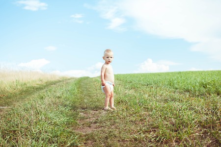 child running in a fieldの写真素材