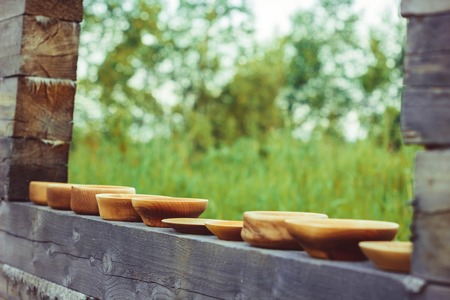 a wooden bowl is outdoors in a treeの写真素材