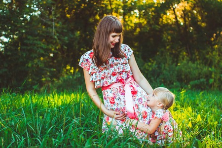 Mother and daughter in park. Mother Day.