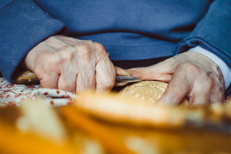 the hands of the craftsmen carved wooden product
