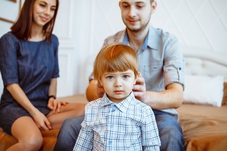 loving mother watching daughter playing with toyの写真素材