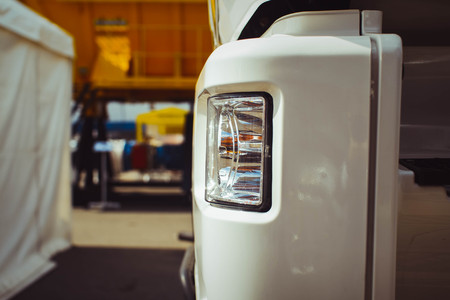 automobile mechanic checking truck in the garage, selective focus