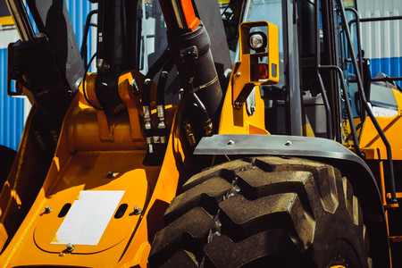 The hydraulic tractor is yellow. Crawler bulldozer at the exhibitionの写真素材