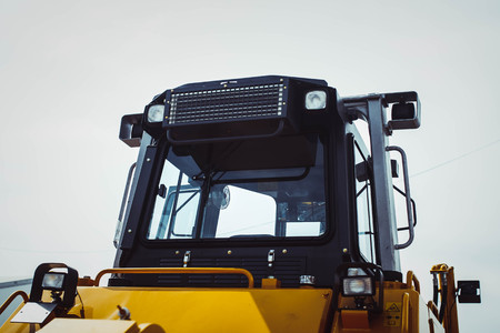 The hydraulic tractor is yellow. Crawler bulldozer at the exhibitionの写真素材