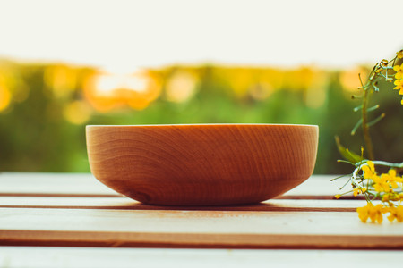 Empty wooden dish on the table in the open airの写真素材
