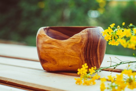 Empty wooden dish on the table in the open airの写真素材