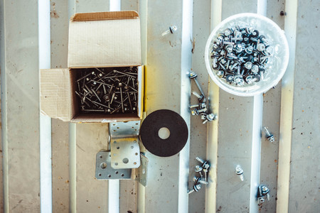 Closeup of roofing screw and screw for metal work on white backgroundの写真素材