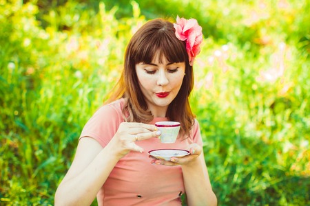 Beautiful Girl Drinking Healthy Green Tea. Healthcare or Herbal medicine conceptの写真素材