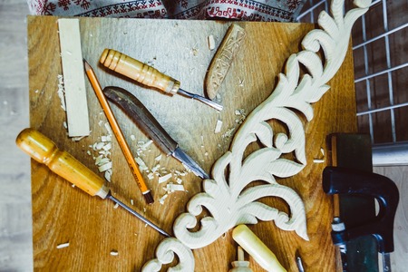 Tool carpenters in the workshop of the wood Carver are on the tableの写真素材
