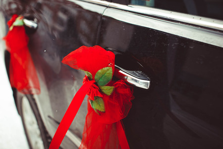 Wedding decoration on wedding car red ribbonの写真素材
