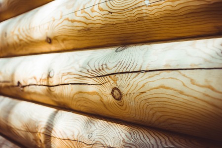 Background of wooden wall. Texture of crafted logsの写真素材