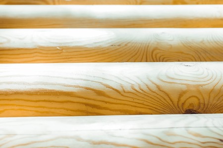 Background of wooden wall. Texture of crafted logsの写真素材