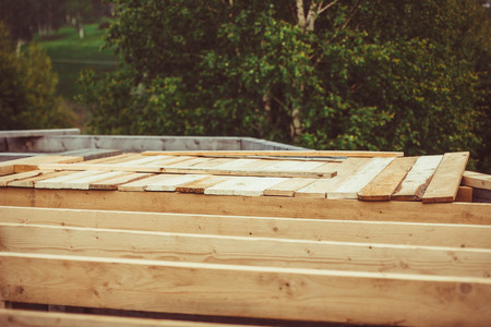 Unfinished, ecological wooden house and building areaの写真素材