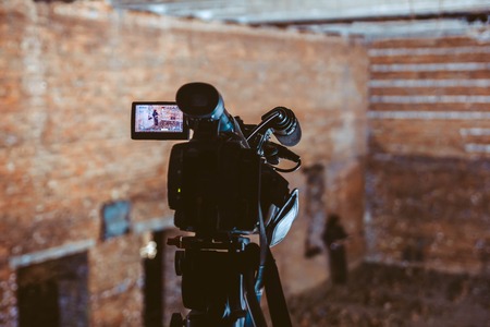 Shooting a music video in a ruined houseの写真素材