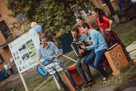 Russia, Novokuzneck - 7.04.2013: musicians sing in the courtyard in Russiaのeditorial素材