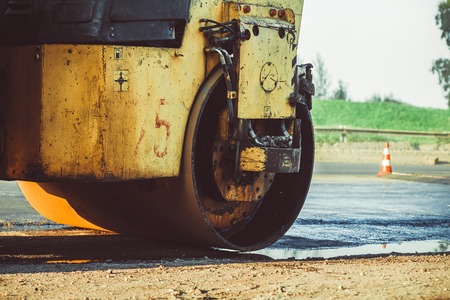 Russia, Novokuzneck, 14.08.2017: Laying asphalt into the city with a rollerのeditorial素材