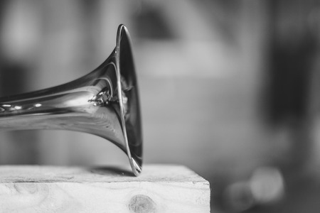 Trumpet on musical notes as background close upの写真素材