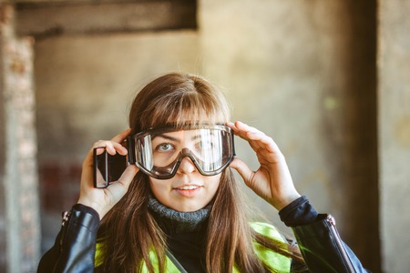 beautiful woman civil engineer close up portrait in front of a sunset backgroundの写真素材