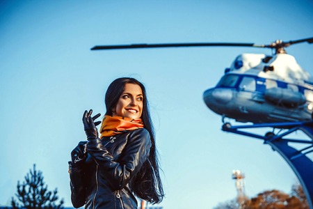 Beautiful business woman standing with a bag at the airport.の写真素材