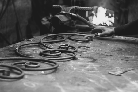 forged products are on the table in the forge workshopの写真素材