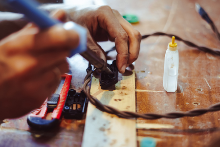 melting solder wire on soldering iron tipの写真素材