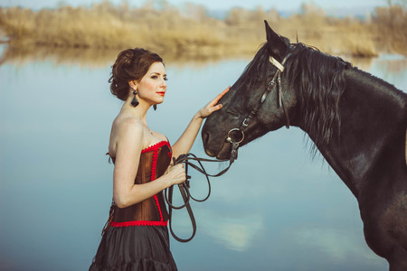 portrait beautiful woman long hair next horseの写真素材