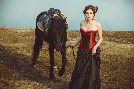 portrait beautiful woman long hair next horseの写真素材