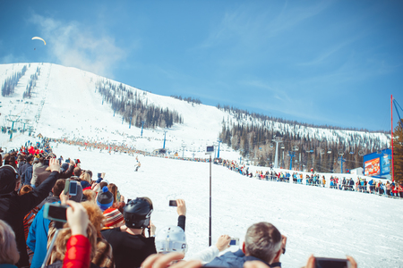 Sheregesh, Kemerovo region, Russia - April 16, 2016: Close up of recording video with smartphone during a ski descent in Siberia at the festivalのeditorial素材