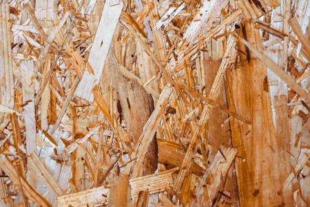 close up pressed wooden panel background, seamless texture of oriented strand board - OSB woodの写真素材