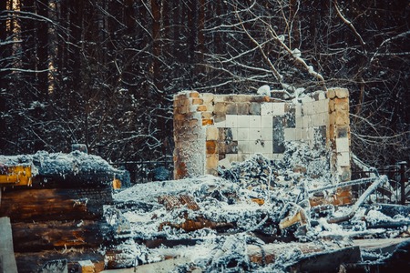 Burned wooden walls the house after the fire. Burnt old wooden building in Russia. Ruined abandoned burnt-out wooden houseの写真素材
