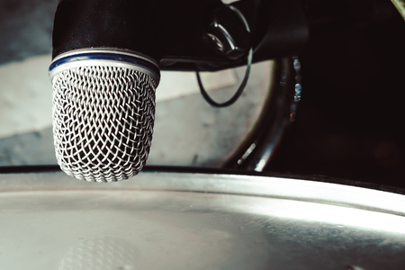 microphone for drum set-up on wall backgroundの写真素材