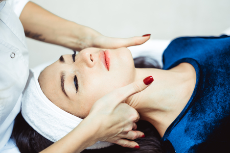 Young, beautiful and healthy woman in spa salon. Traditional oriental massage therapy and beauty treatments.の写真素材