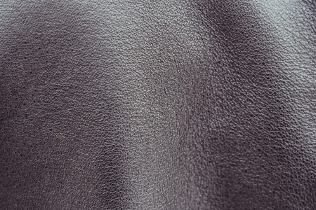 texture of black leather jacket with pleats
