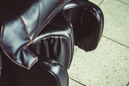 black leather massage chair close-up at the Mallの写真素材