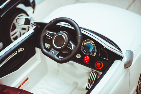 Toy Car Traffic StopClose view of a toy police car behind another plain white toy car as if it was a traffic stop.の写真素材