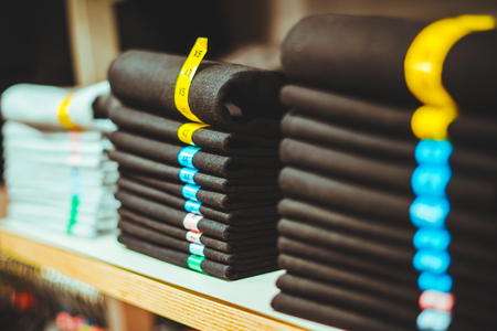 sale shopping background. clothes on shelves in storeの写真素材