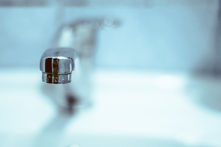 the faucet in the sink tip closeupの写真素材