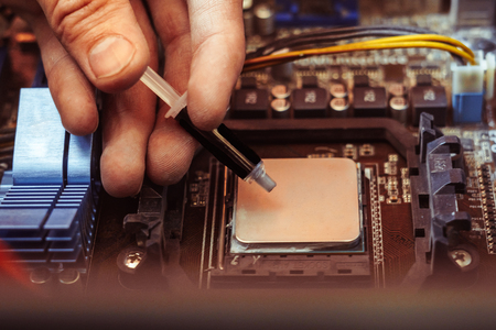 Thermal paste applied on a computer CPU.