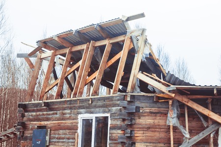 Novokuzneck, Russia - 29.04.2017: collapsed roof of a wooden houseのeditorial素材
