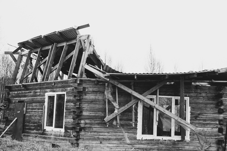 Novokuzneck, Russia - 29.04.2017: collapsed roof of a wooden houseのeditorial素材