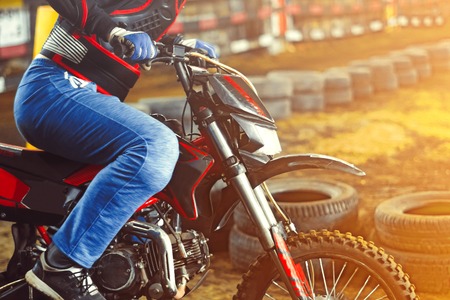 A picture of a biker making a stunt and jumps in the airの写真素材