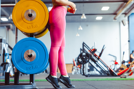 Beautiful blonde is standing in the gymの写真素材