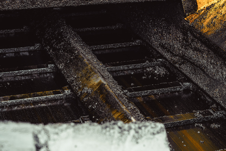 Road construction works with roller compactor machine and asphalt finisherの写真素材