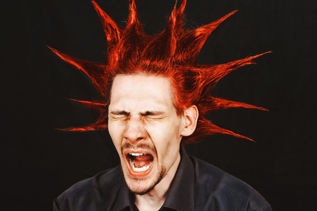 the guy with the hair and red hair yawnsの写真素材