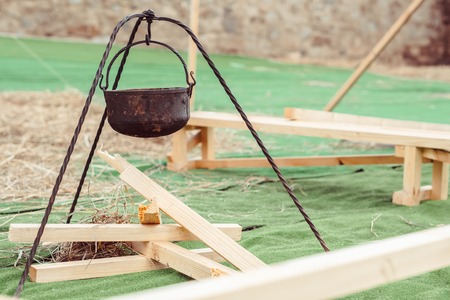 decorative pot hanging over a tree on artificial grassの写真素材