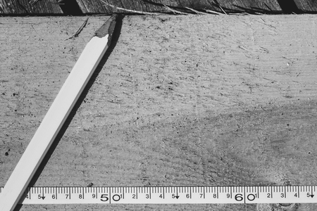 tape measure on the brown wooden background