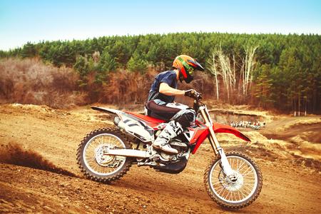 A picture of a biker making a stunt and jumps in the airの写真素材